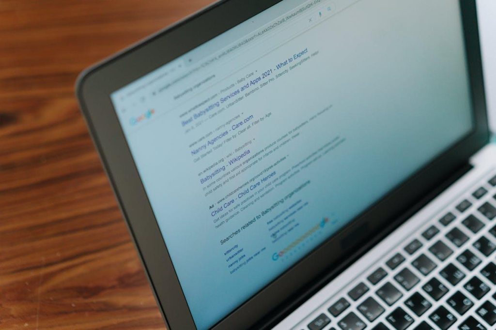 Google search results on a laptop.